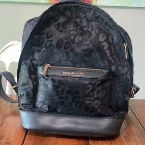Michael Kors leopard backpack.